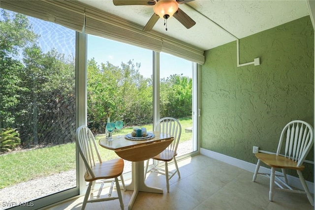 3051 Sandpiper Bay Cir Unit I102, Naples, FL 34112 - sunroom / solarium featuring a textured wall and baseboards