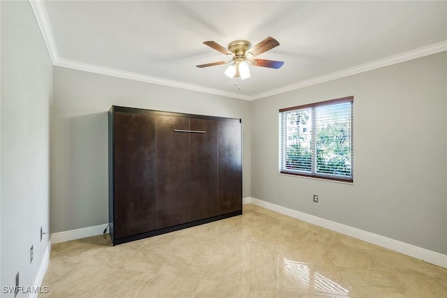 3051 Sandpiper Bay Cir Unit I102, Naples, FL 34112 - unfurnished bedroom featuring crown molding and a ceiling fan