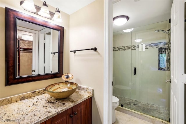 3051 Sandpiper Bay Cir Unit I102, Naples, FL 34112 - bathroom with vanity and a shower stall