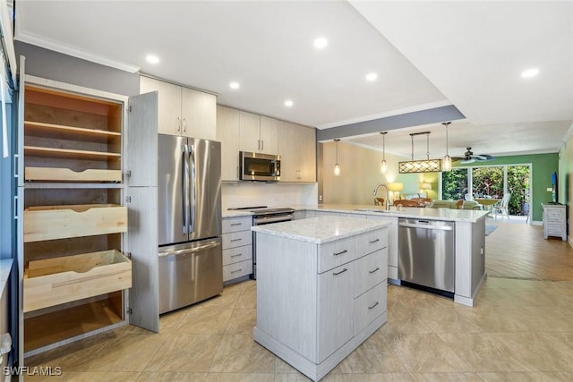 3051 Sandpiper Bay Cir Unit I102, Naples, FL 34112 - kitchen with appliances with stainless steel finishes, a peninsula, crown molding, open floor plan, and a ceiling fan