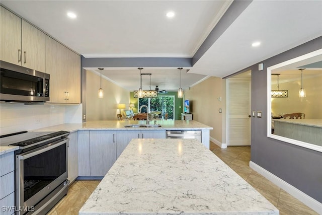 3051 Sandpiper Bay Cir Unit I102, Naples, FL 34112 - kitchen featuring stainless steel appliances, crown molding, a peninsula, light stone counters, and tasteful backsplash