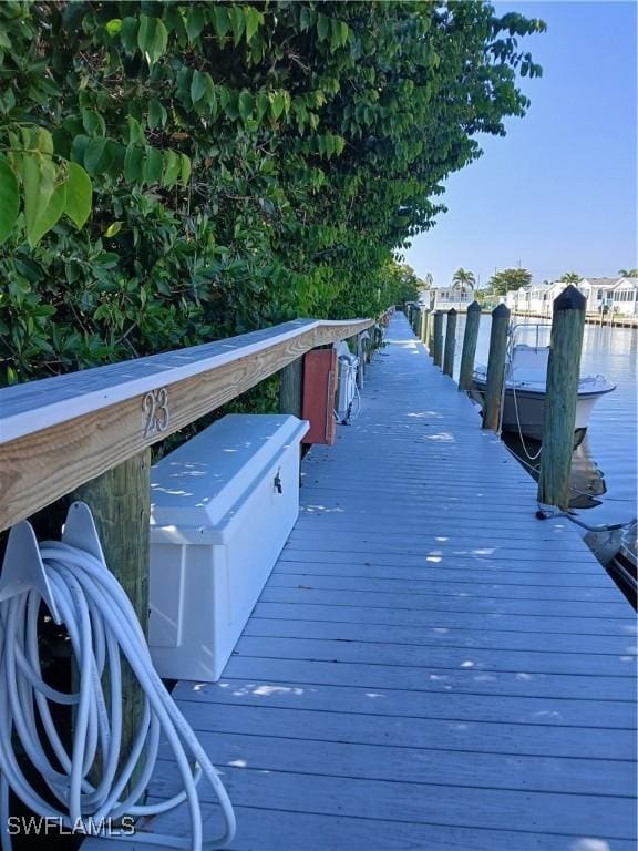 3051 Sandpiper Bay Cir Unit I102, Naples, FL 34112 - dock area with a water view