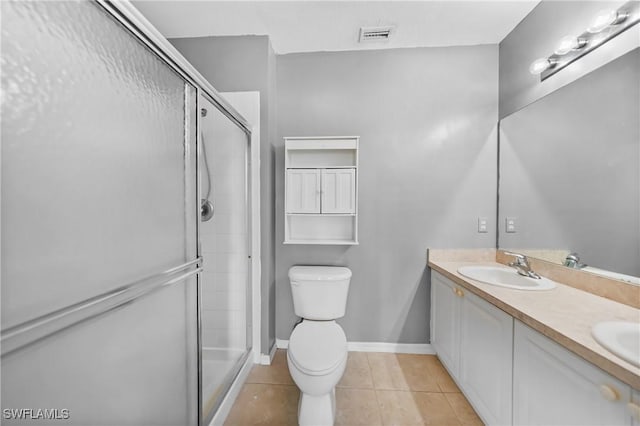 2061 Willow Hammock Cir Unit 303, Punta Gorda, FL 33983 - full bath with a shower stall, tile patterned floors, double vanity, toilet, and baseboards
