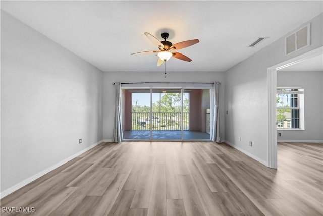 2061 Willow Hammock Cir Unit 303, Punta Gorda, FL 33983 - unfurnished room with a ceiling fan, visible vents, and a wealth of natural light