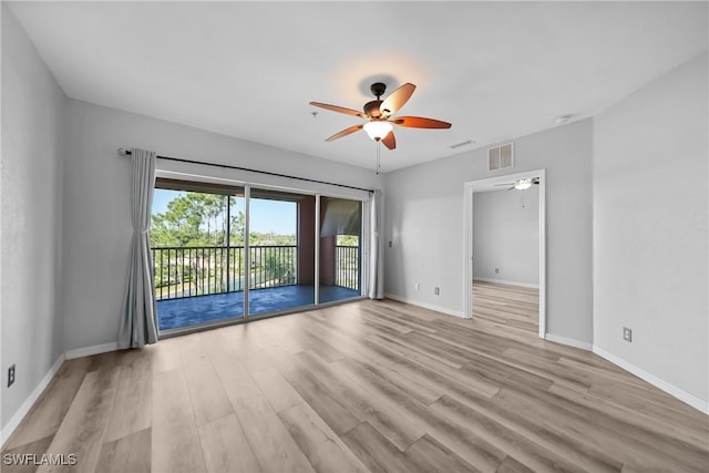 2061 Willow Hammock Cir Unit 303, Punta Gorda, FL 33983 - spare room with wood finished floors, visible vents, baseboards, and ceiling fan