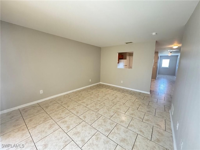 5031 Locke Ln, Lehigh Acres, FL 33973 - unfurnished room with visible vents, baseboards, and light tile patterned floors