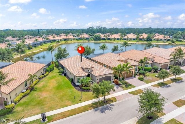 aerial view featuring a residential view and a water view