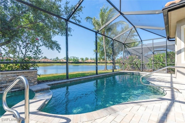 pool with glass enclosure, a patio area, and a water view