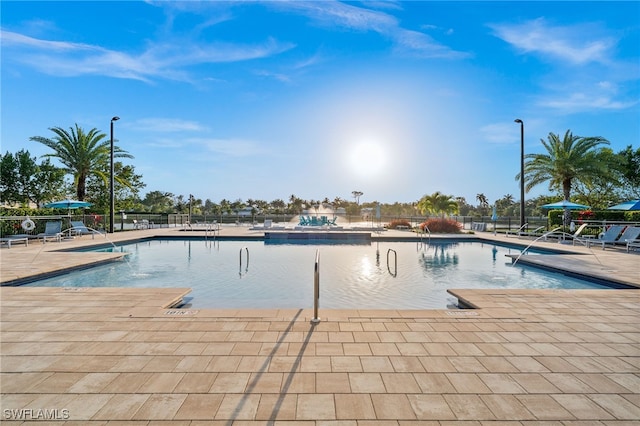 4558 Arboretum Cir Unit 103, Naples, FL 34112 - community pool featuring fence and a patio