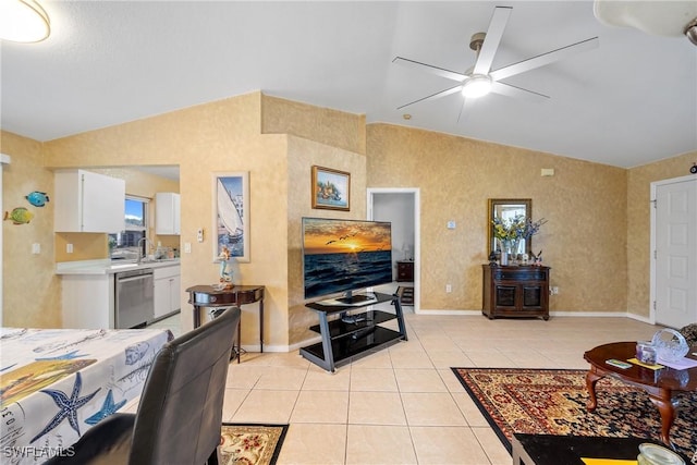 living room featuring light tile patterned floors, ceiling fan, vaulted ceiling, and baseboards