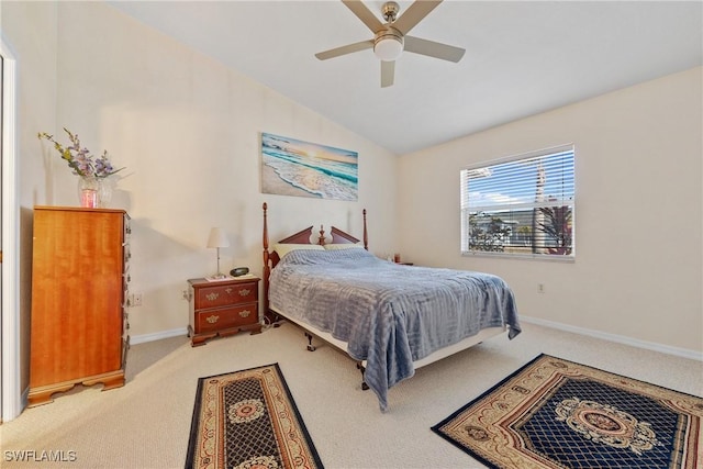 carpeted bedroom with ceiling fan, vaulted ceiling, and baseboards