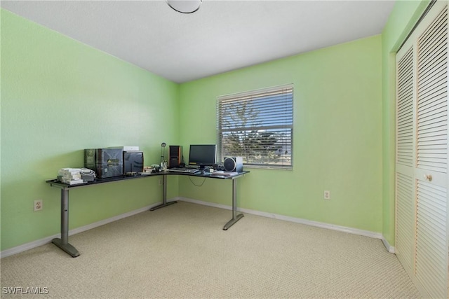 office space with light colored carpet and baseboards