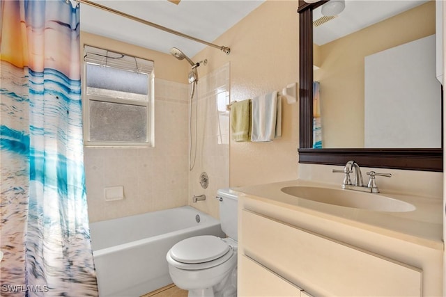 full bath featuring shower / bath combo with shower curtain, vanity, toilet, and visible vents