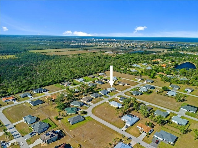birds eye view of property with a residential view