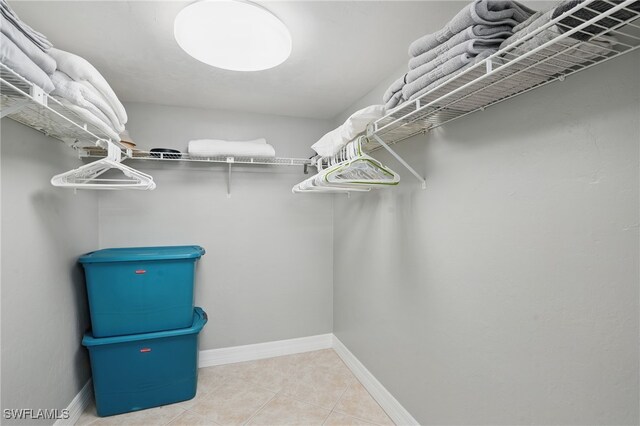4321 Country Club Blvd Unit 102, Cape Coral, FL 33904 - spacious closet featuring tile patterned flooring