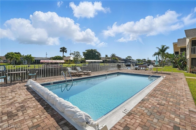 4321 Country Club Blvd Unit 102, Cape Coral, FL 33904 - community pool featuring fence and a patio area