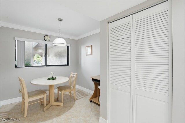 4321 Country Club Blvd Unit 102, Cape Coral, FL 33904 - dining area featuring ornamental molding, light tile patterned floors, and baseboards