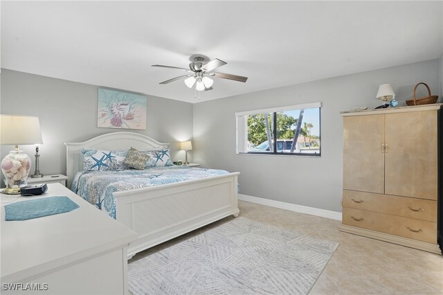 4321 Country Club Blvd Unit 102, Cape Coral, FL 33904 - bedroom featuring light tile patterned floors, baseboards, and a ceiling fan