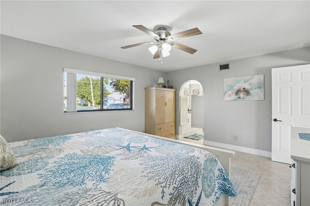 4321 Country Club Blvd Unit 102, Cape Coral, FL 33904 - bedroom featuring light tile patterned flooring, a ceiling fan, and baseboards
