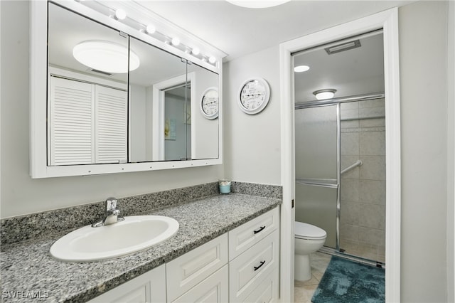 4321 Country Club Blvd Unit 102, Cape Coral, FL 33904 - bathroom with a shower stall, toilet, vanity, and tile patterned flooring