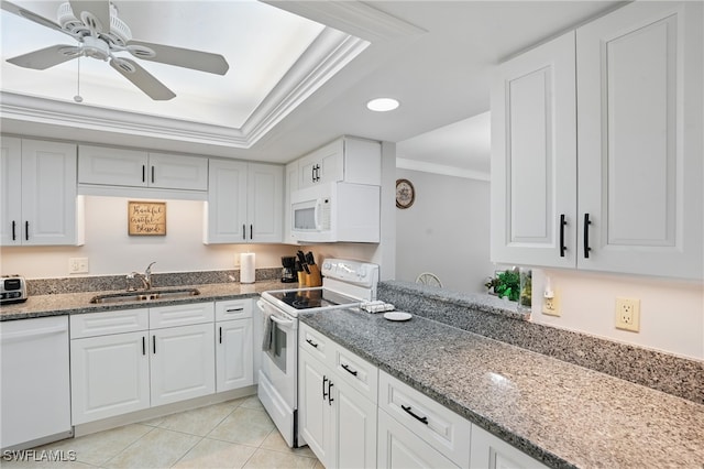 4321 Country Club Blvd Unit 102, Cape Coral, FL 33904 - kitchen featuring white appliances, a sink, crown molding, dark stone counters, and light tile patterned floors