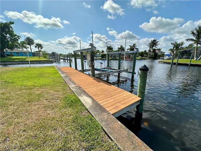 4343 S Gulf Cir, North Fort Myers, FL 33903 - dock area with a lawn, boat lift, and a water view