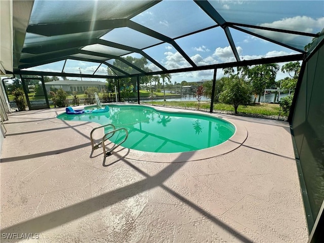 4343 S Gulf Cir, North Fort Myers, FL 33903 - outdoor pool featuring a patio area, a water view, and a lanai