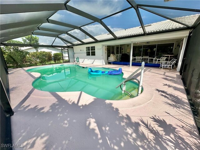 4343 S Gulf Cir, North Fort Myers, FL 33903 - outdoor pool with a patio area and glass enclosure