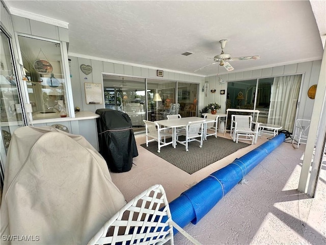 4343 S Gulf Cir, North Fort Myers, FL 33903 - living room featuring crown molding and ceiling fan