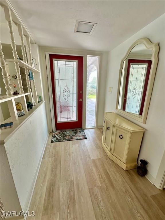 4343 S Gulf Cir, North Fort Myers, FL 33903 - entrance foyer featuring light wood-type flooring and baseboards