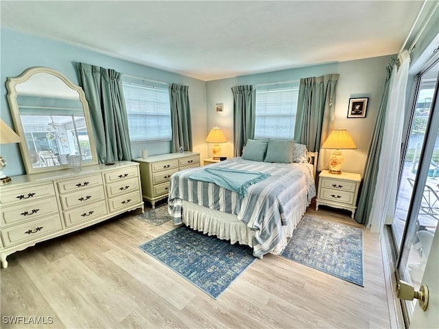4343 S Gulf Cir, North Fort Myers, FL 33903 - bedroom with light wood-style floors and multiple windows