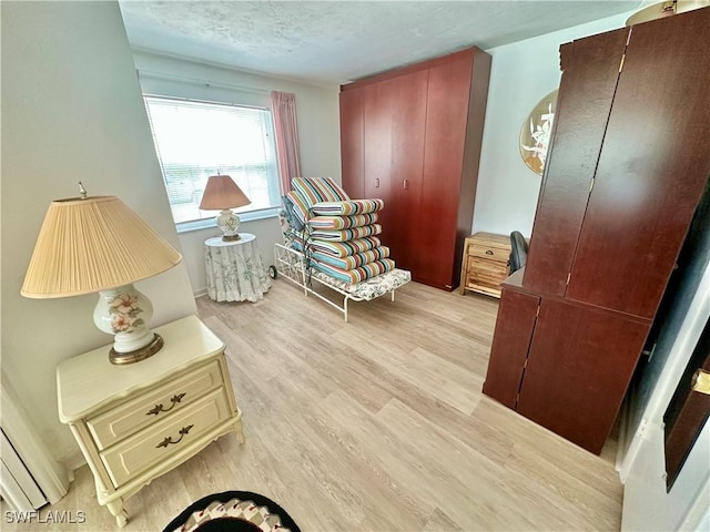 4343 S Gulf Cir, North Fort Myers, FL 33903 - sitting room with light wood finished floors and a textured ceiling