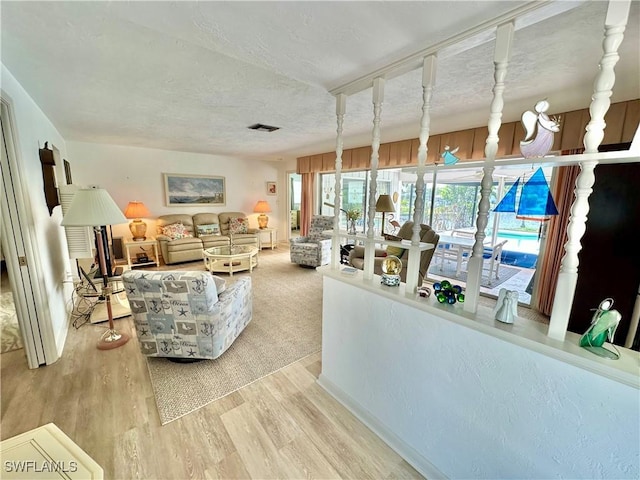 4343 S Gulf Cir, North Fort Myers, FL 33903 - living room with wood finished floors and a textured ceiling