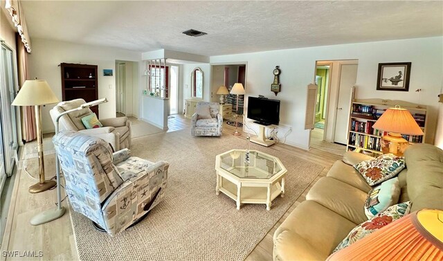4343 S Gulf Cir, North Fort Myers, FL 33903 - living area with wood finished floors and a textured ceiling