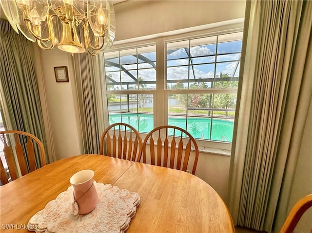 4343 S Gulf Cir, North Fort Myers, FL 33903 - dining room featuring a chandelier
