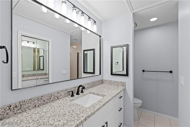 full bathroom with tile patterned floors, baseboards, toilet, and vanity