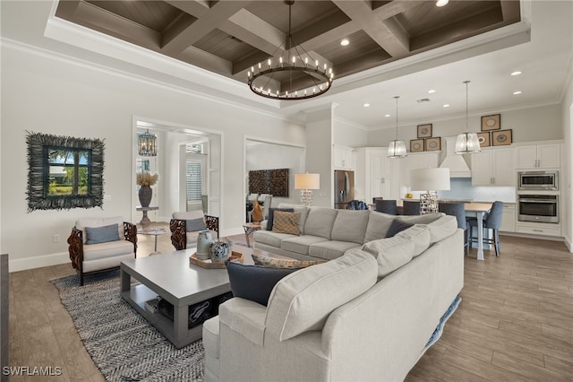 living room with an inviting chandelier, recessed lighting, coffered ceiling, a high ceiling, and crown molding