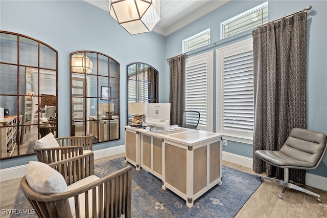 office space with baseboards, ornamental molding, and dark wood-style flooring