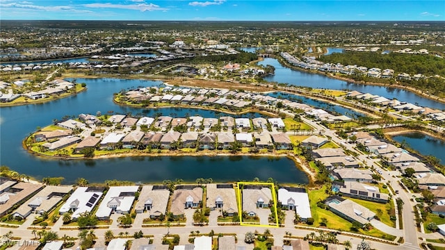 birds eye view of property featuring a residential view and a water view
