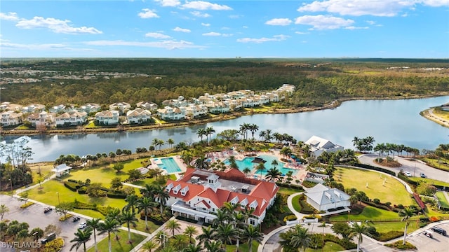 bird's eye view with a view of trees and a water view