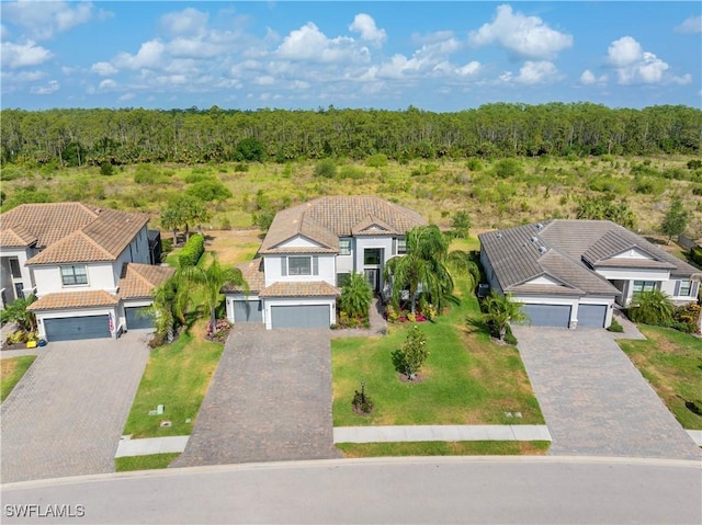 19128 Elston Way, Estero, FL 33928 - aerial view of property and surrounding area with a forest