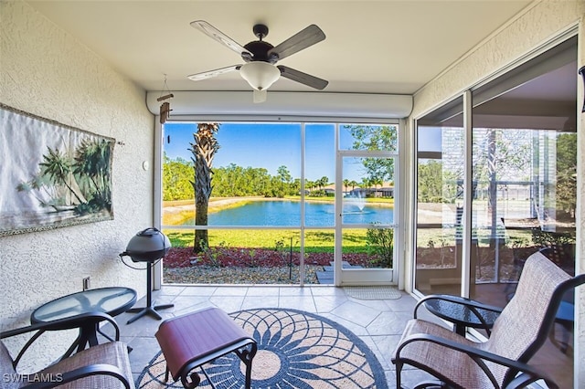 11029 Mill Creek Way Unit 406, Fort Myers, FL 33913 - sunroom / solarium featuring a textured wall, a ceiling fan, a water view, and healthy amount of natural light