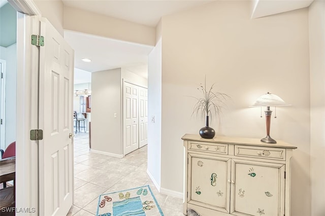 11029 Mill Creek Way Unit 406, Fort Myers, FL 33913 - hall featuring light tile patterned floors and baseboards