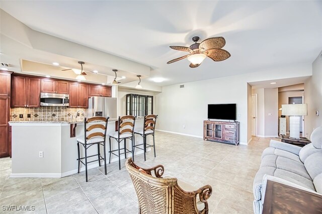 11029 Mill Creek Way Unit 406, Fort Myers, FL 33913 - living area with ceiling fan, light tile patterned floors, and recessed lighting