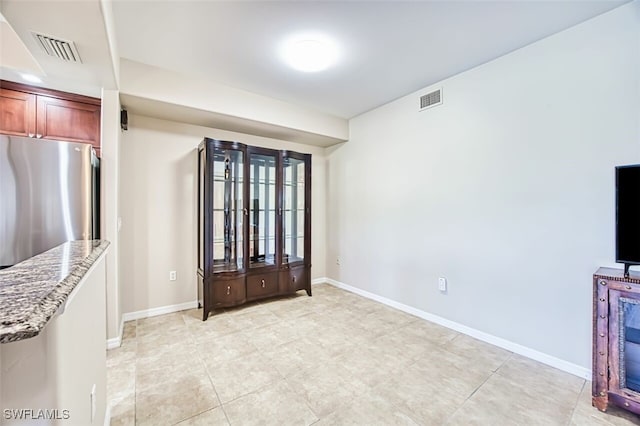 11029 Mill Creek Way Unit 406, Fort Myers, FL 33913 - spare room with baseboards and light tile patterned floors