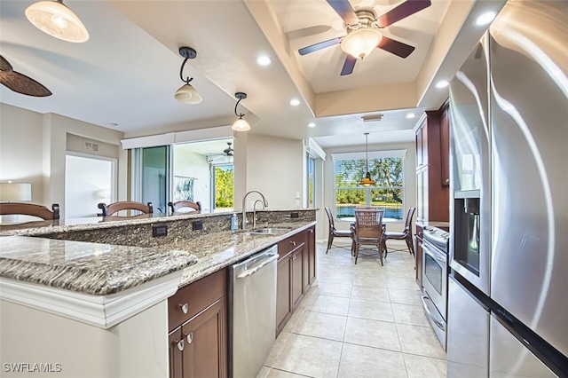 11029 Mill Creek Way Unit 406, Fort Myers, FL 33913 - kitchen featuring stainless steel appliances, a ceiling fan, light tile patterned floors, plenty of natural light, and recessed lighting