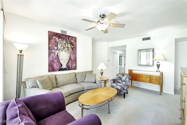 2190 Arielle Dr Unit 903, Naples, FL 34109 - living area featuring baseboards, a ceiling fan, visible vents, and light carpet