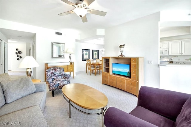2190 Arielle Dr Unit 903, Naples, FL 34109 - living room with visible vents, a ceiling fan, and light carpet