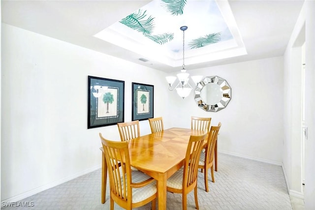 2190 Arielle Dr Unit 903, Naples, FL 34109 - dining area featuring visible vents, light carpet, a tray ceiling, and a notable chandelier