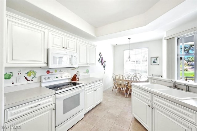 2190 Arielle Dr Unit 903, Naples, FL 34109 - kitchen with a sink, light tile patterned flooring, white appliances, light countertops, and white cabinets